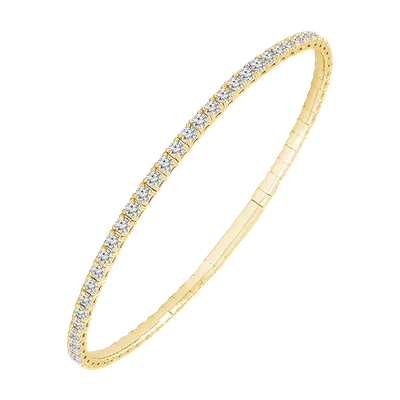 Gold bangle bracelet lined with round white stones