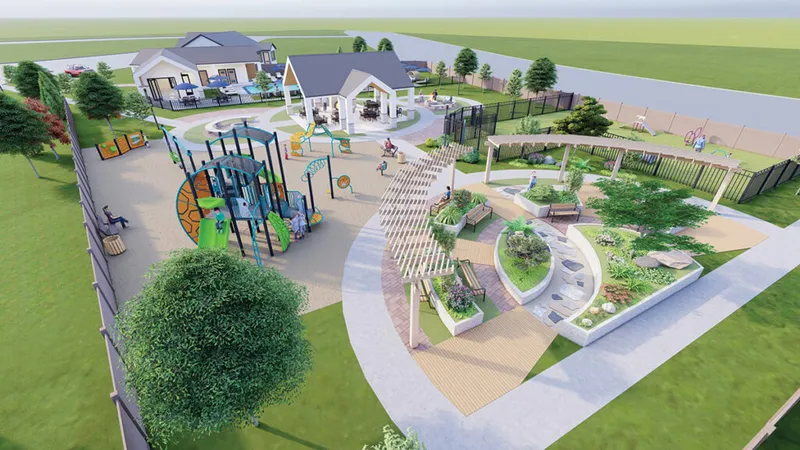 Aerial render of a residential community park with a playground, garden beds, pergola, and a small clubhouse