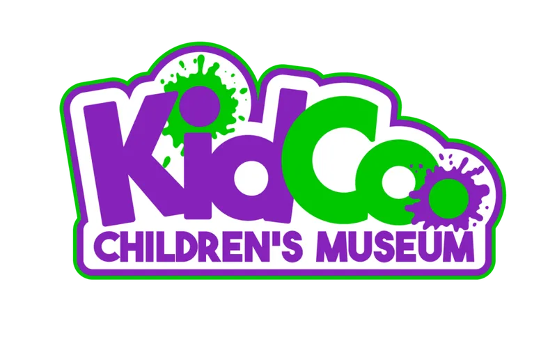 KidCo Children's Museum logo in purple and green with paint splat accents