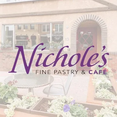 Nichole's Fine Pastry & Café logo overlaid on a brick storefront with outdoor seating