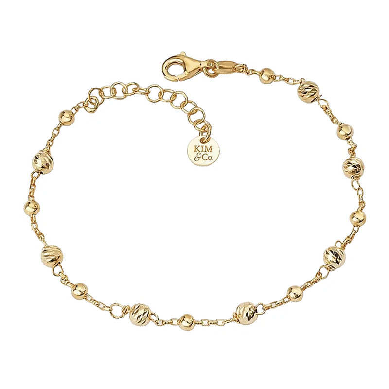 Gold chain bracelet with faceted ball beads and lobster clasp, small branded charm