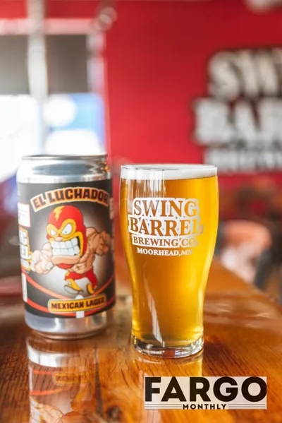 El Luchador Mexican Lager can beside a full pint glass at Swing Barrel Brewing Co., Moorhead MN