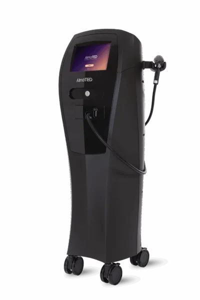 Black AlmaTED medical device on wheels with touchscreen display and handheld applicator