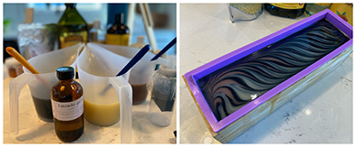 Soap-making supplies beside a mold with dark swirled soap and purple edges