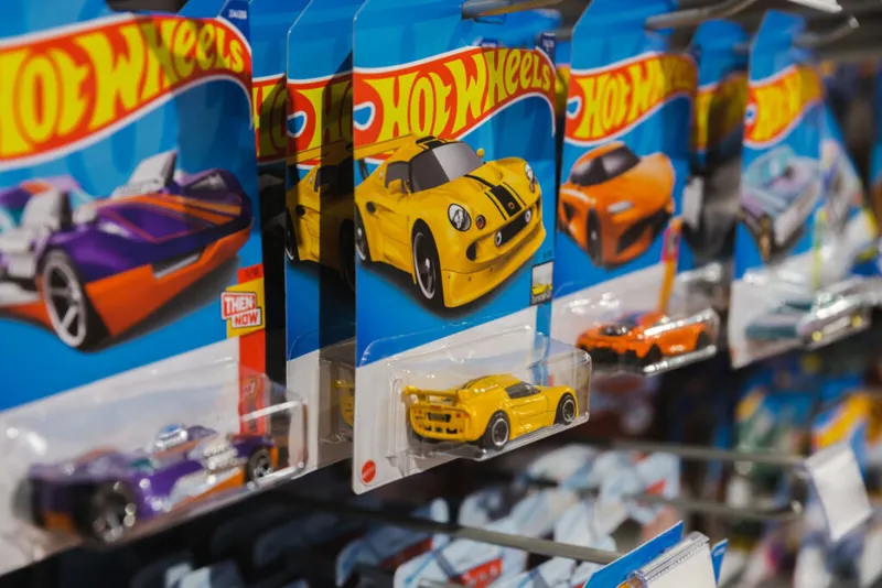 Hot Wheels die-cast cars in packaging displayed on a retail shelf