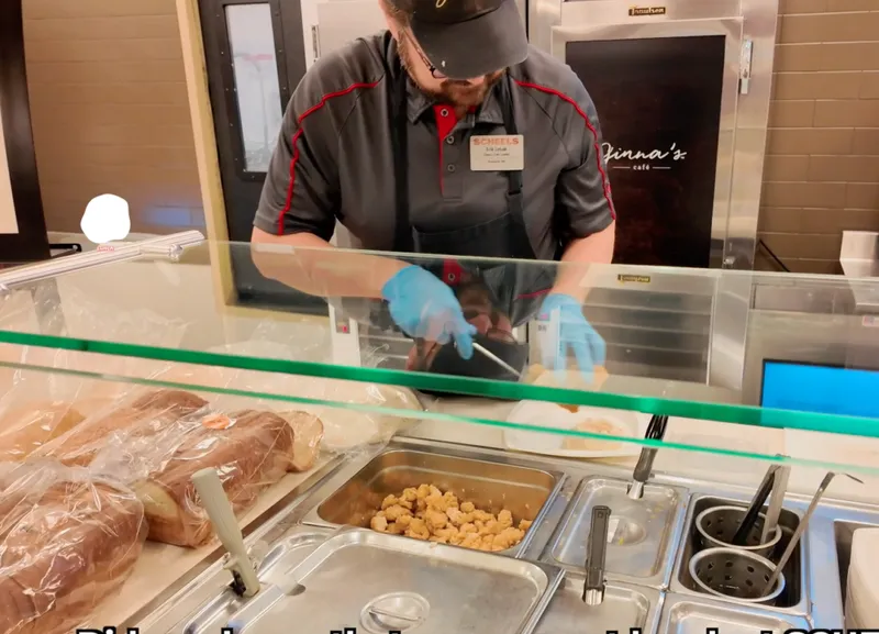 ginna's cafe worker serving lunch
