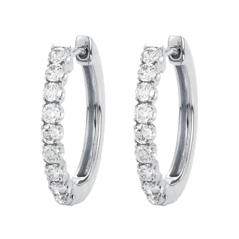 Pair of silver hoop earrings with round white gemstones along the front
