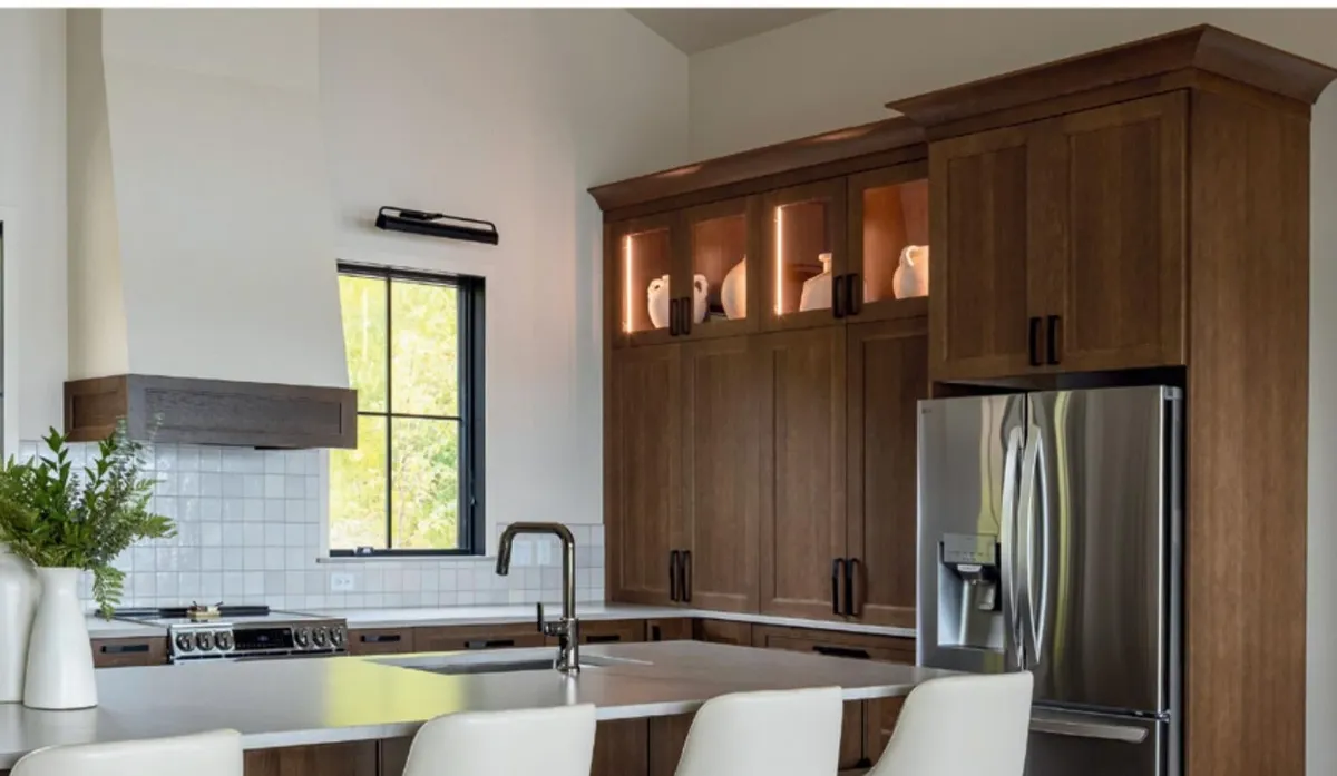 Remodeled kitchen with wood cabinetry and a large island