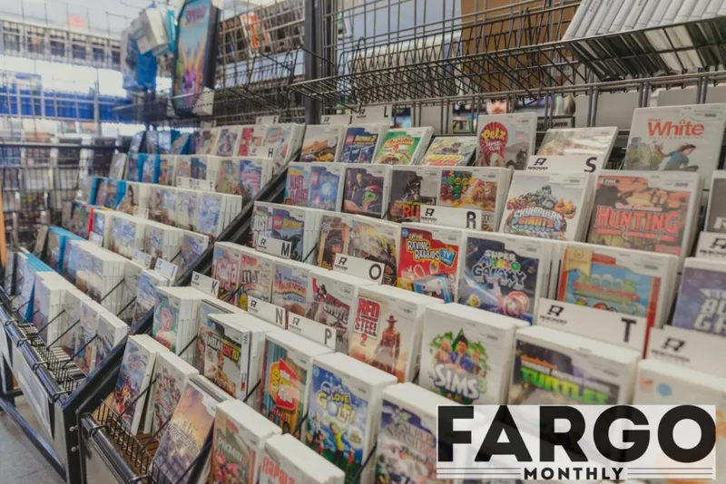 Rows of used Nintendo Wii game cases filling store shelves