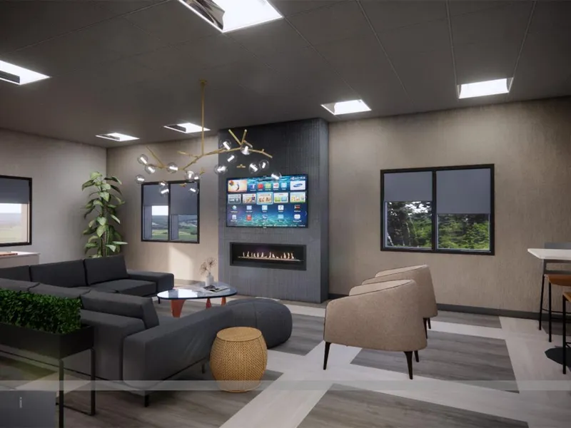 Modern lounge with dark sectional sofa, linear fireplace, wall-mounted TV, and branch chandelier