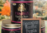 Two jars of Ugandan vanilla bean paste with branded labels