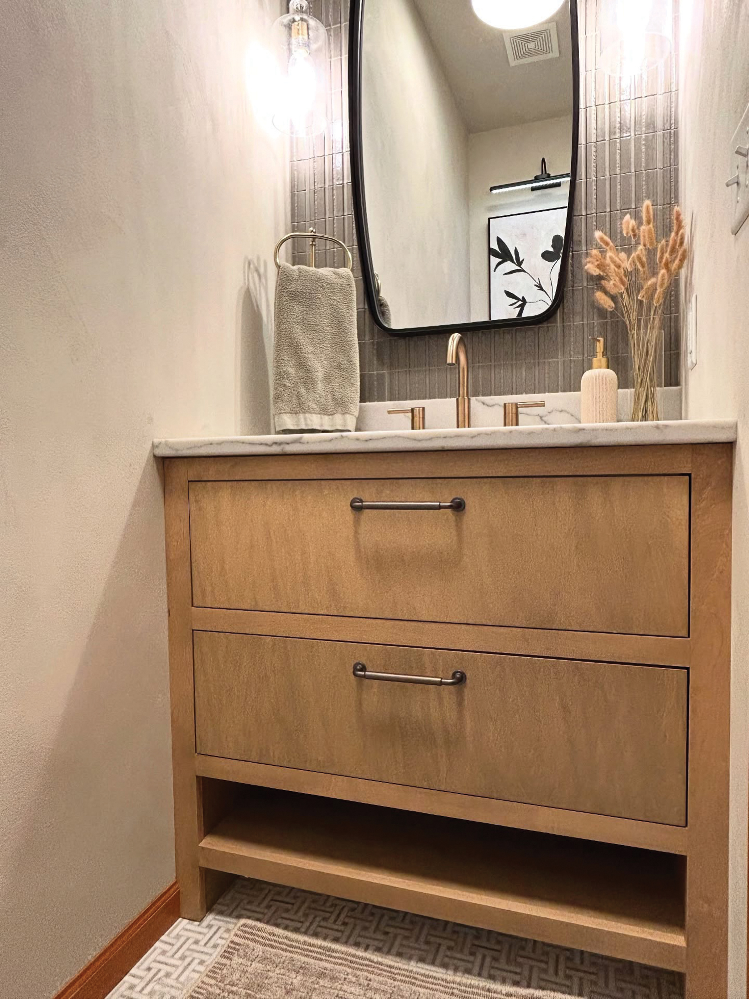 Wood vanity in the renovated powder room