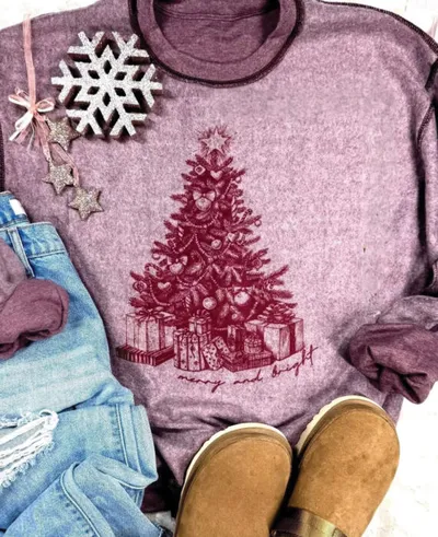 Heather purple sweatshirt with red Christmas tree and 'merry and bright' text, styled with jeans and tan boots