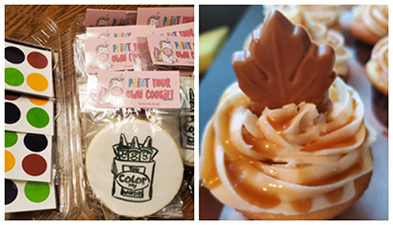 Paint-your-own cookie kit beside a caramel cupcake topped with a chocolate maple leaf