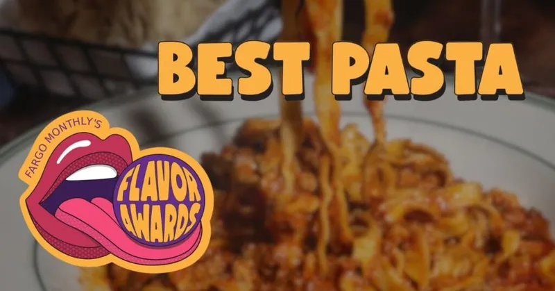 Fargo Monthly Flavor Awards Best Pasta graphic over a plate of meat sauce pasta