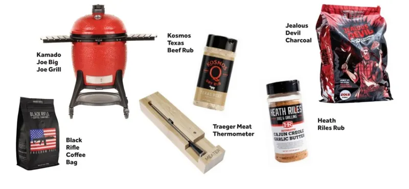 BBQ gift set featuring a red kamado grill, charcoal bag, meat thermometer, spice rubs, and coffee