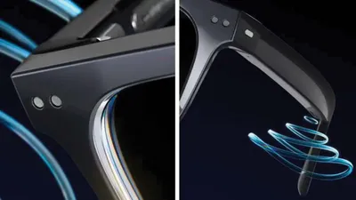 Close-up of sleek dark eyeglass frames with blue light accents against dark background