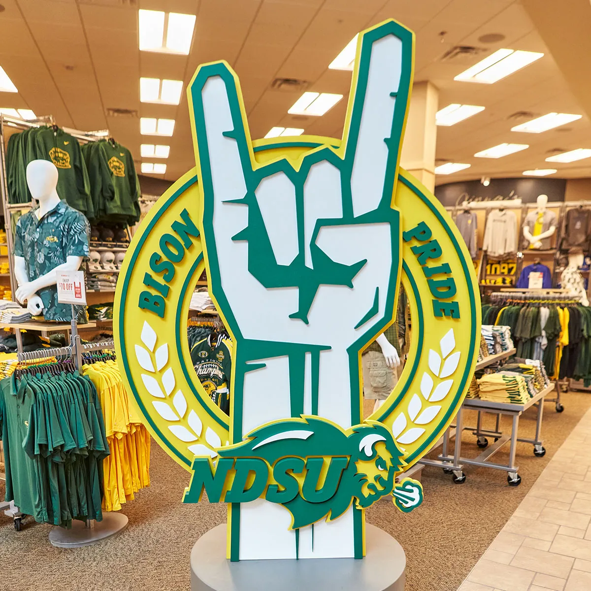 Large NDSU Bison Pride sign with foam hand gesture inside a sporting goods store