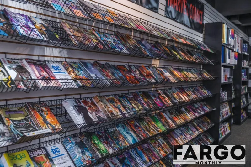 Wall of comic book racks packed with colorful titles including DC and Marvel comics
