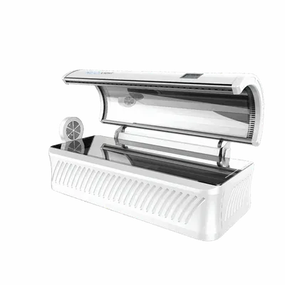 Open white tanning bed with UV lamps and ventilation panels