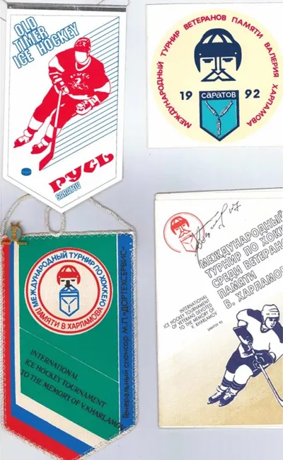Four Russian ice hockey pennants and patches, including a 1992 Saratov veterans tournament emblem