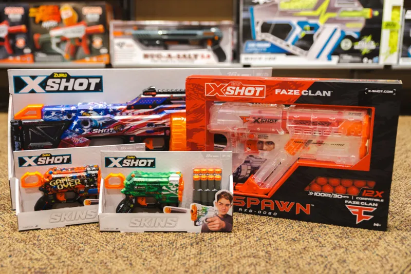 Four X-Shot foam blaster toy sets in packaging, including a Faze Clan Spawn edition