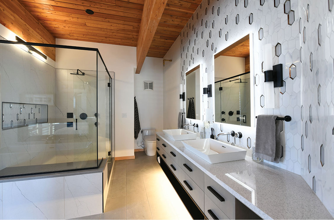 Primary bathroom with glass shower and double vanity