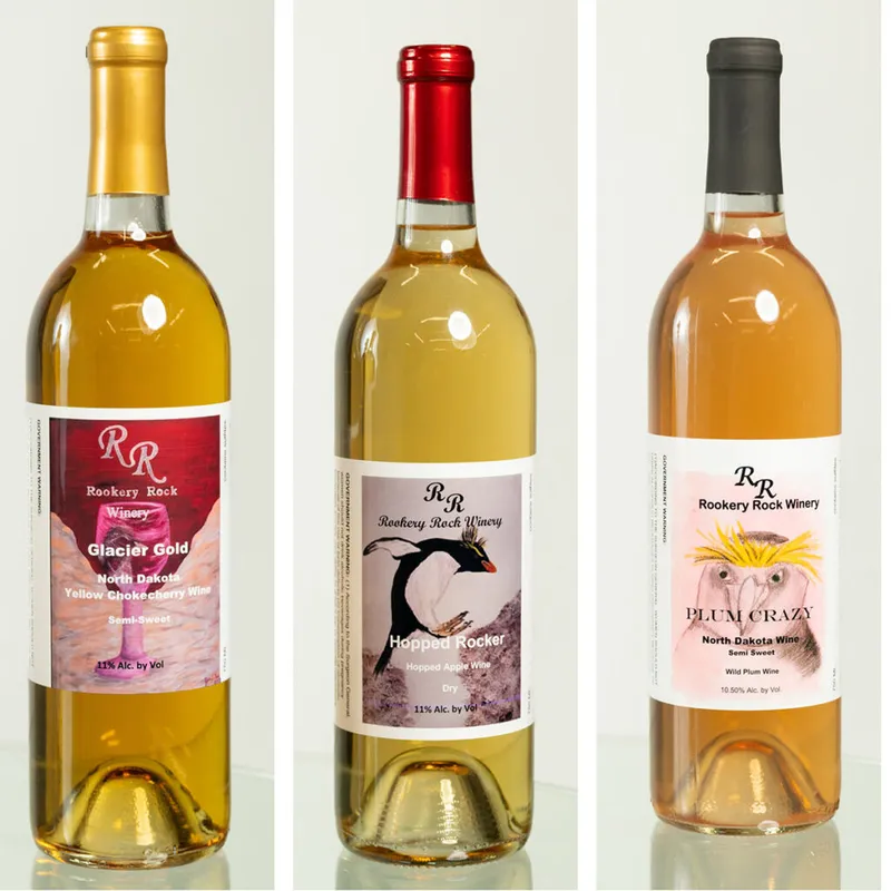 Three Rookery Rock Winery bottles: Glacier Gold, Hopped Rocker, and Plum Crazy