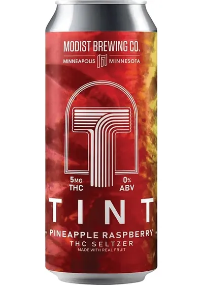 Modist Brewing Co. Tint Pineapple Raspberry THC Seltzer can with red and yellow tie-dye design