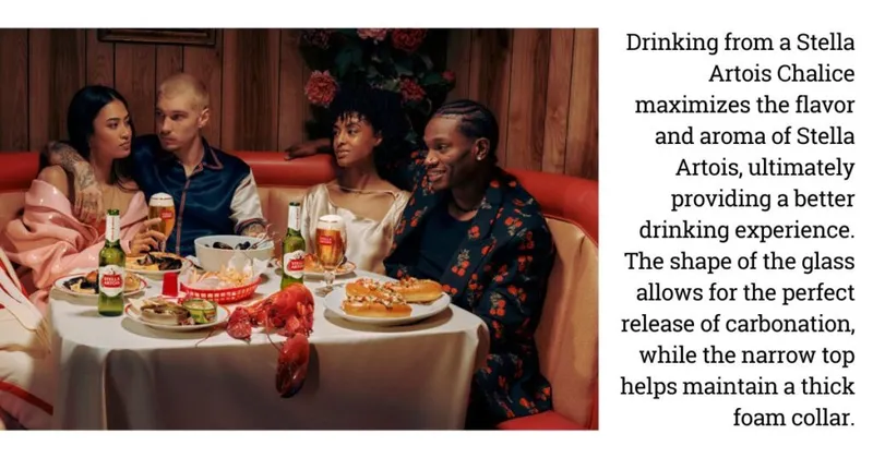 Four friends dining at a restaurant table with beer, lobster, and shared plates