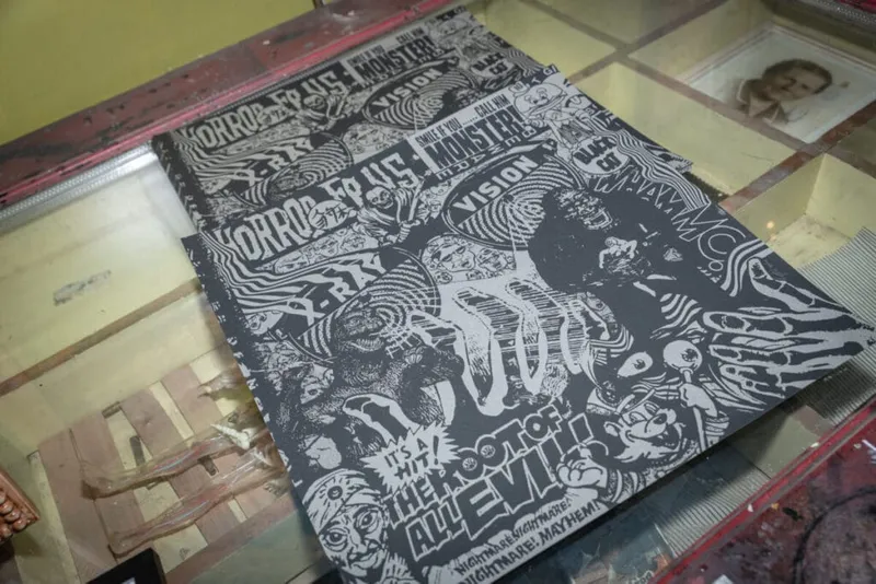 Black-and-white zine with chaotic horror-themed illustration and bold text reading "Root of All Evil